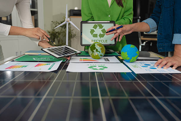 istock colleagues discussing data working and tablet, laptop with on Construction Site project, green energy and solar panel concept. 2228894014