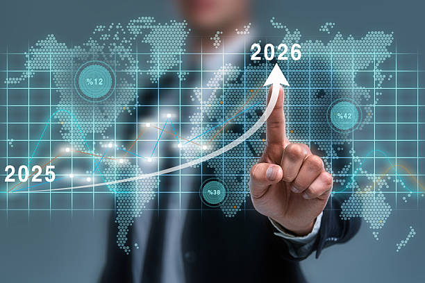 Businessman pointing virtual icon of year 2026 target