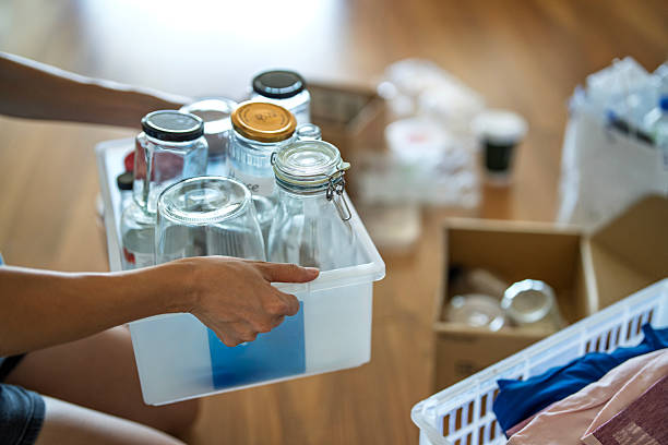 istock Woman Practicing Sustainable Living by Sorting Recyclable Items 2228906861