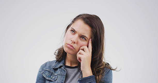 istock Ideas, thinking and question with woman on studio space for brainstorming, planning or problem solving. Face, solution and vision with person isolated on white background for thoughtful contemplation 2228911439