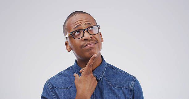 istock Idea, question and why with black man on studio space for brainstorming, contemplation or solution. Planning, problem solving and thinking with person isolated on white background for decision 2228911443