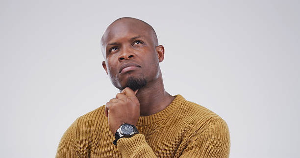 istock Choice, thinking and question with black man on studio space for brainstorming, contemplation or solution. Ideas, planning and why with African person isolated on white background for decision 2228911497