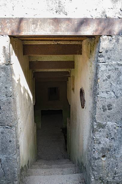 istock German Lbunker underground entrance from the Second World War. It has a window for the guard 2228915042