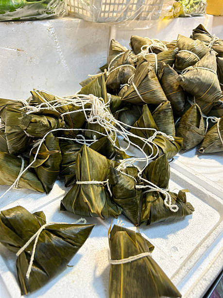 istock rice dumpling wrap in bamoo leaves 2228917011