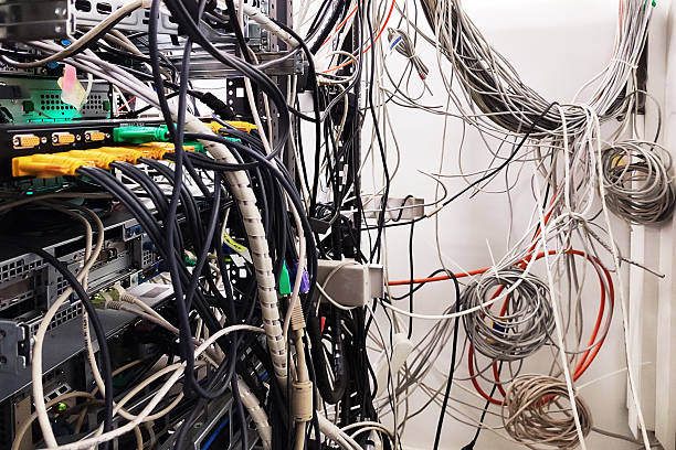 istock Server Room Chaos A tangled web of wires and cables 2228918559