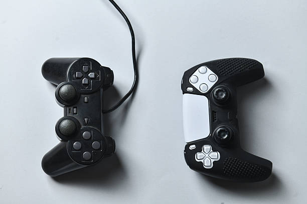 Pair Of Gaming Joysticks – Wireless And Wired – On Neutral Gray Surface