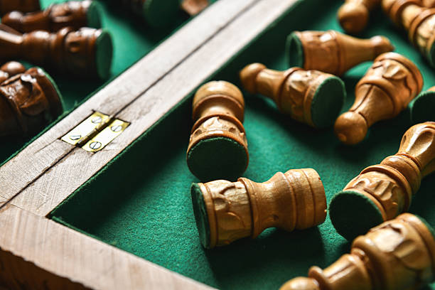 Luxury Chessboard Interior With Chess Pieces Lying Flat On Green Fabric