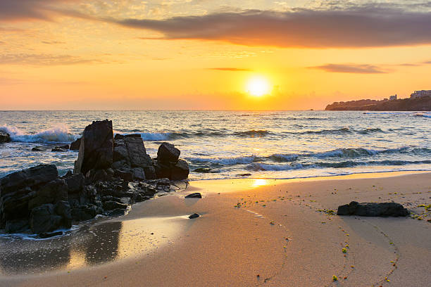 istock sunrise at the beach with gorgeous sky 2228921525