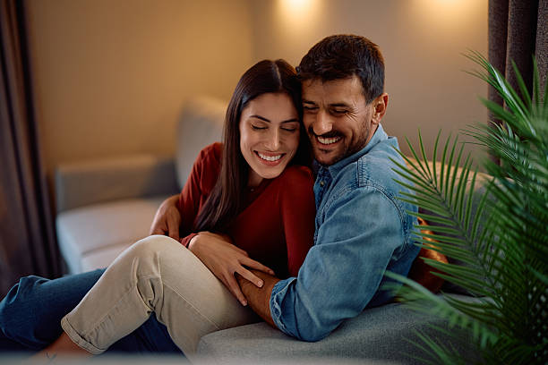 istock Embraced couple in love relaxing on the sofa. 2228923648