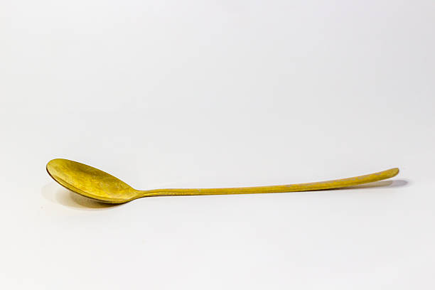 istock Minimalist Gold Spoon Isolated on White Surface Long-Handled Elegant Utensil Kitchen Tableware Food Serving Culinary Tool Restaurant Diner Studio Shot Gleaming Flat Lay Copy Space 2228924502