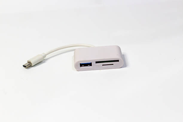 istock Portable white USB-C hub with data transfer capabilities: SD card and USB ports ensure compatibility for photographers and videographers needing streamlined connectivity for modern devices, 2228925266