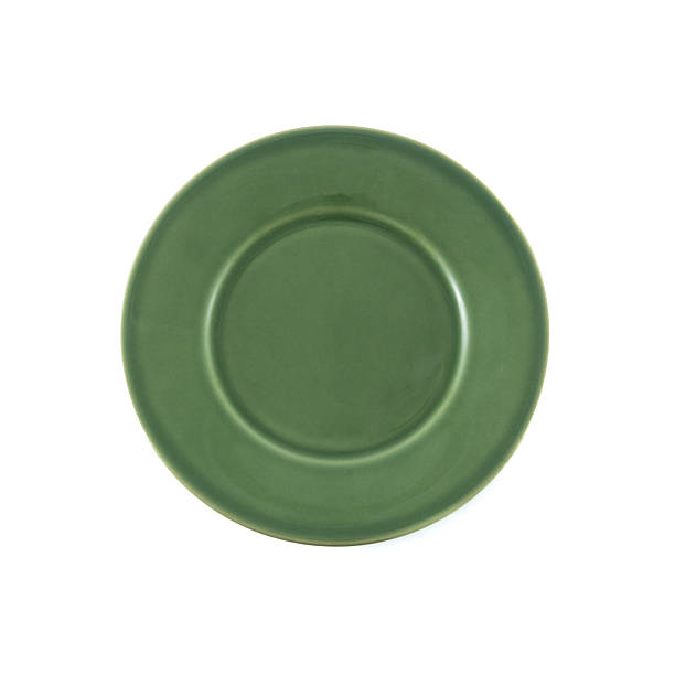 istock Green ceramic plate isolated over white background 2228925790