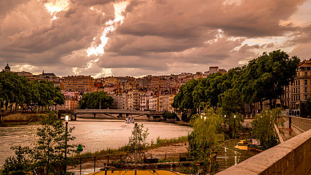 Lyon, France - june 30, 2025 : Saône River quay in Lyon at dusk after a storm