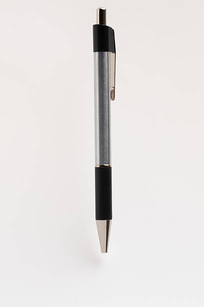 istock A sleek, modern black and silver retractable ballpoint pen isolated on a clean white background. 2228927153