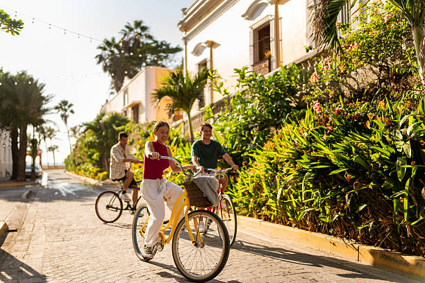 istock Friends riding bicycles on a historic district 2228928482