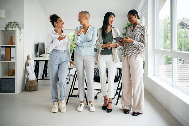 istock Group of professional women collaborating in a bright modern office setting 2228928512
