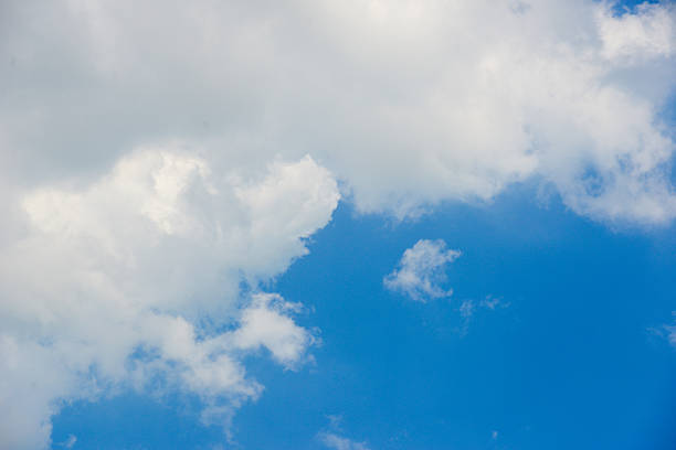 istock Photo of some white whispy clouds and blue sky cloudscape 2228929683