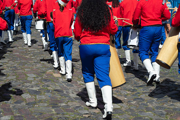 Salvador, Bahia, Brazil - July 02, 2025: Public school students are seen playing a musical instrument during a Bahia independence civic parade in Pelourinho, Salvador, Brazil.