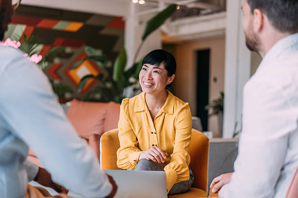 istock Group of business persons talking in the office. 2228938351