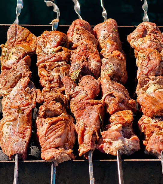 Savory Grilled Meat Skewers Cooking to Perfection.