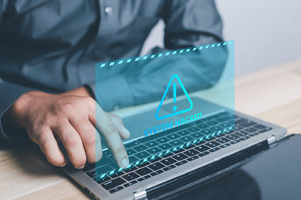 istock Person pointing at red system warning icon with unlocked padlock symbols, 2228938789