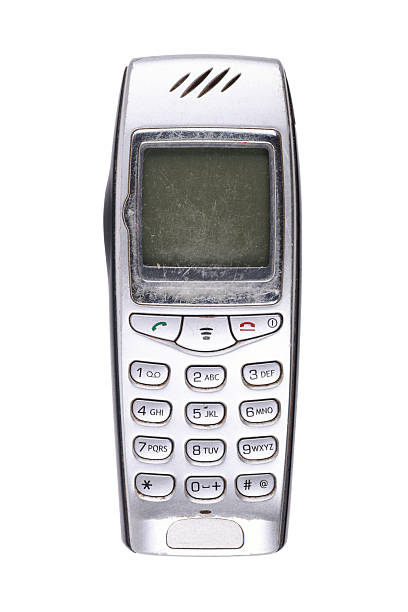 Classic mobile phone from the early 2000s with simple design isolated on white background.