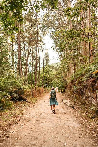 istock Backpacker with Scallop Shell on Camino 2228944381