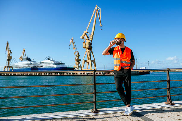 engineering, foreman, supervisor, worker, loading master in work site, control to the teamwork by walkie talkie radio for job done in the same direction, working at risk and high level of insurance
