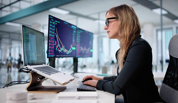 istock Trader Analyzing Stocks With Multiple Screens In A Financial Company Office 2228949055