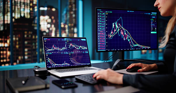 istock Diligent Businesswoman Analyzing Stock Market Trends On Computer 2228949651