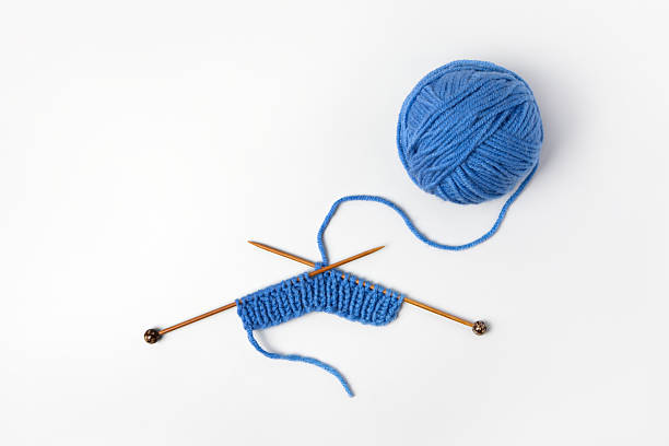istock Blue knitted wool and knitting needles 2228950315