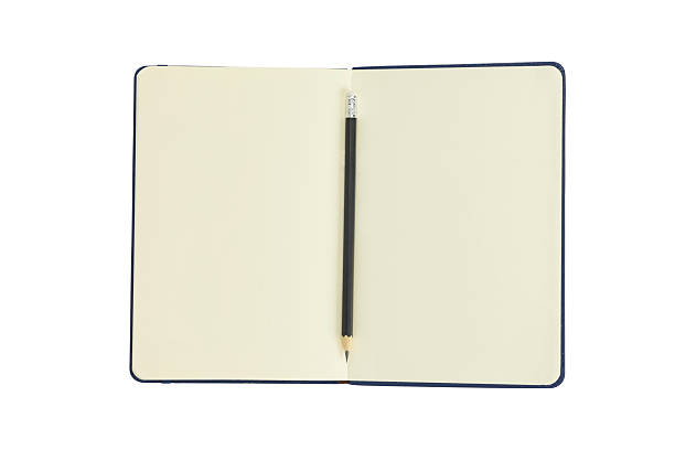 istock Open notebook with blank pages for writing and a pencil, isolated on white background with clipping path. 2228951943