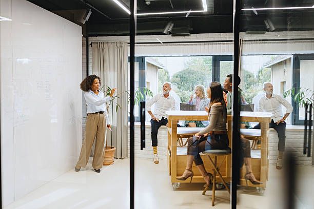istock Multiracial Team Discussing AI Solutions in Modern Office 2228952114
