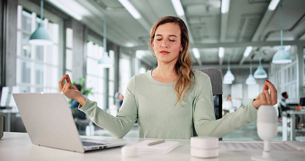 istock Corporate Woman Finding Balance Through Meditation 2228954092