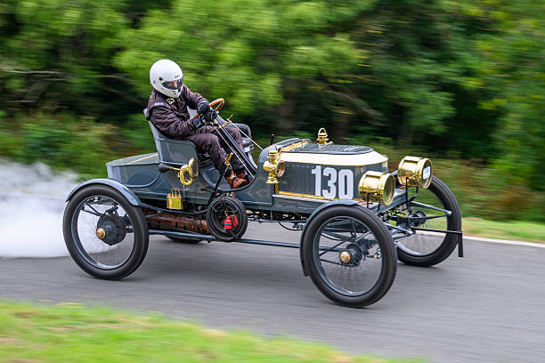 Replica of a old historic vehicle named patent motorcar isolated in white back with shadow
