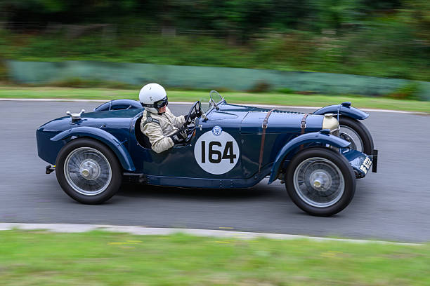 Cheltenham, Gloucestershire, England – August 3 2025 Sports vintage motor car racing up a hill