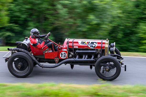 Cheltenham, Gloucestershire, England – August 3 2025 Sports vintage motor car racing up a hill