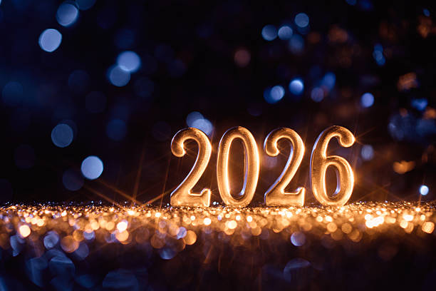 istock Illuminated Silver 2026 Numbers with Sparkling Golden Lights and Blue Bokeh Glow 2228957583