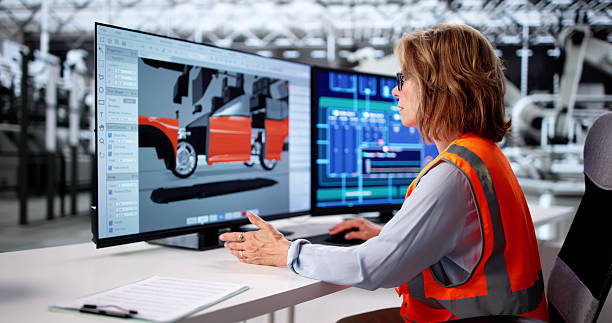 istock Expert Engineer Examining Electric Car Manufacture With Computer 2228958260