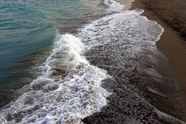 The sea waves rushing onto the shore are a fascinating sight. They can be gentle and affectionate, like the rippling surface of the sea, or powerful and furious, crashing on the shore in foamy cascades. The sound of the waves, sometimes soothing, sometimes loud, complements the picture, creating a unique atmosphere of the sea.