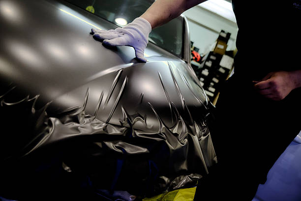 istock Car Repair Workshop Mechanics Working with Parts 2228961713