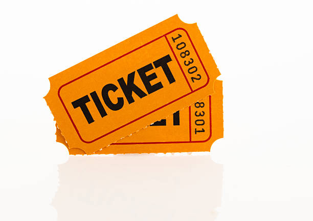 Two numbered orange admission tickets isolated on white background