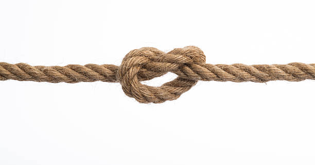istock Overhand knot tied on brown hemp rope 2228962910