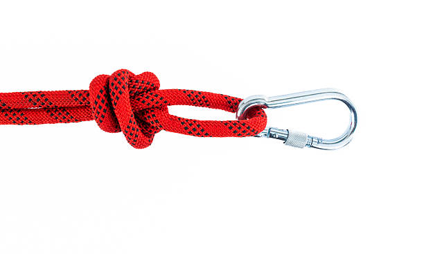 istock Red carabiner with robe isolated on white background 2228962944