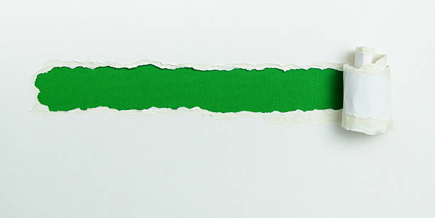 istock Tear open the white paper on the green paper 2228963123