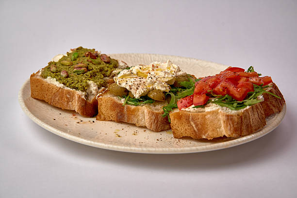 istock An Array of Deliciously Crafted Open-Faced Sandwiches Featuring Unique Toppings Like Avocado, Cream Cheese, and Fresh Vegetables on Toast 2228965200
