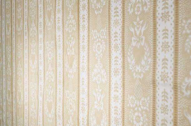 istock Old wallpaper on the wall. Old wallpaper for texture or background. 2228965759