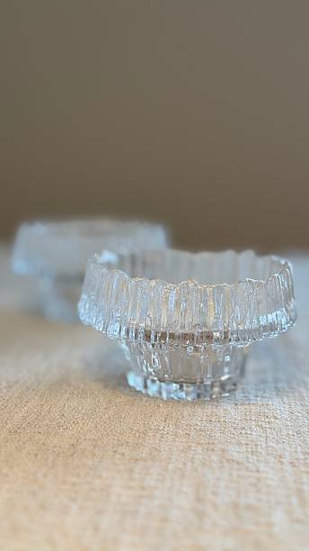 istock Glass tea light holder on a beige linen tablecloth 2228971261