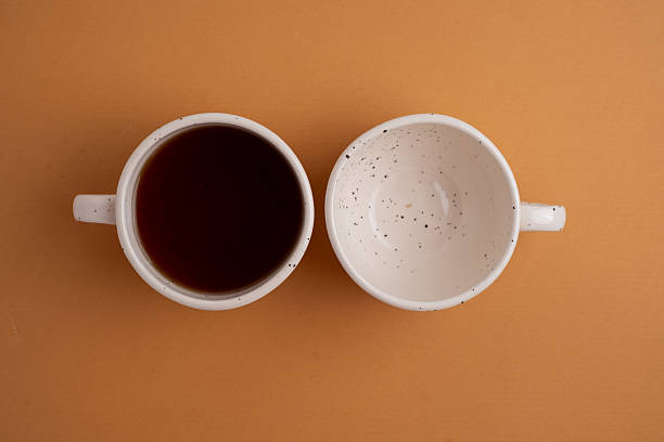 istock Coffee and clock on a colored background.  Time to drink coffee. Break time. Creative idea. 2228974278