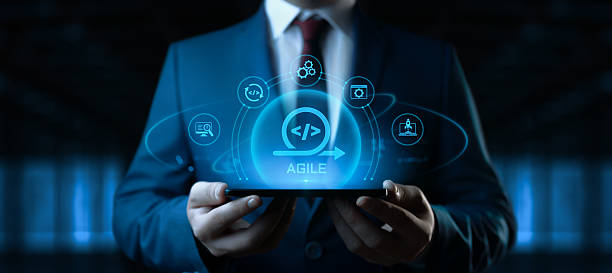 istock Businessman Holding Smartphone with Agile Development Icons on Screen. Software Development Concept 2228974286